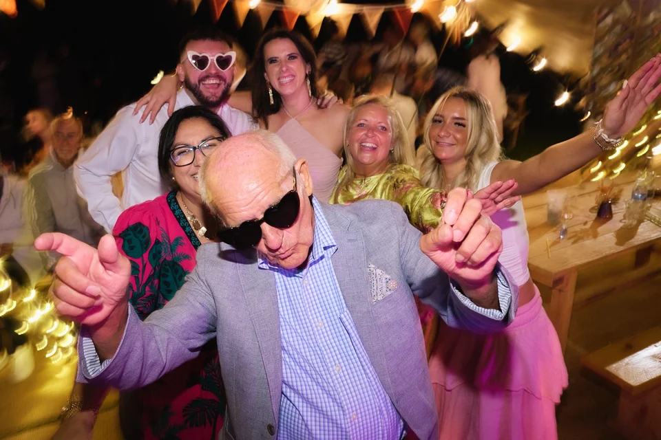 Friends dancing and wearing sunglasses